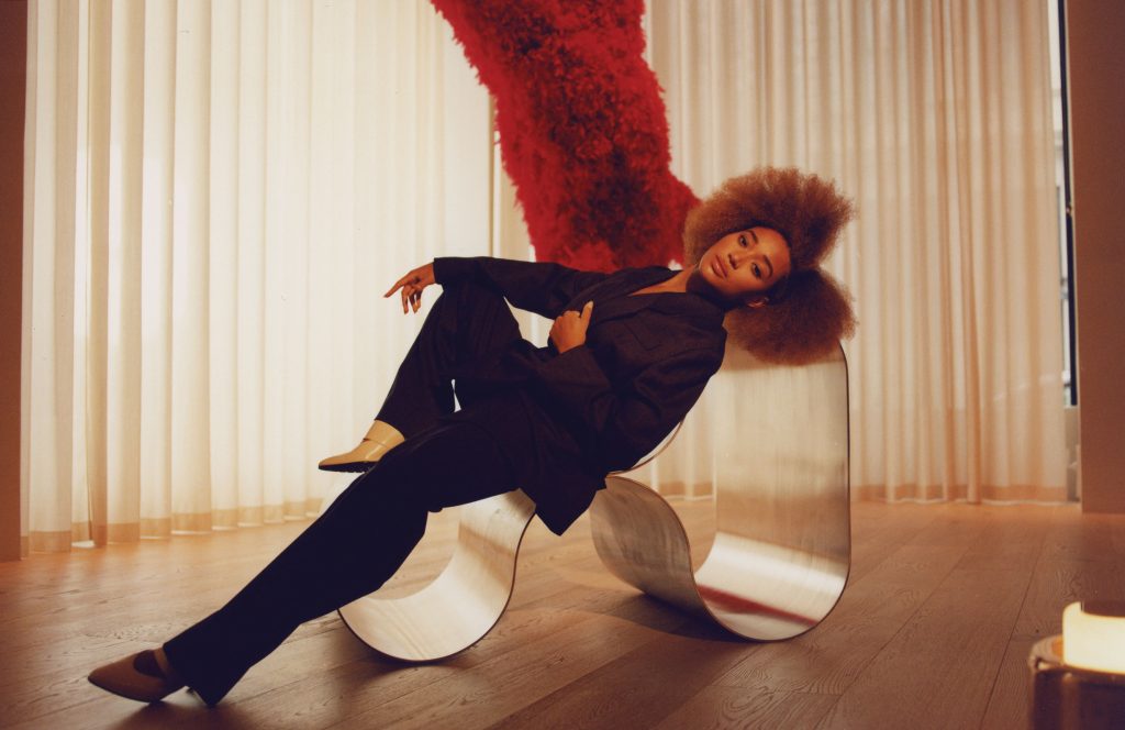 Amandla Stenberg reclining on the sculptural Eternity Chair in the Flaunt editorial.