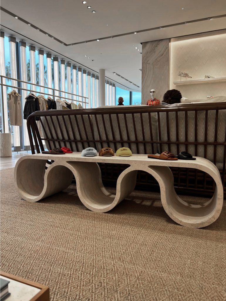 Front view of the curved travertine Eternity Bench in Cannes.