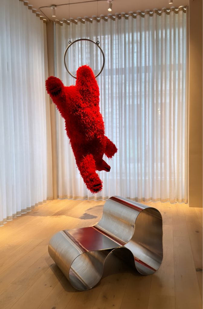 Eternity Chair displayed alongside artwork in the New York gallery.